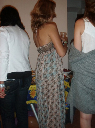 Woman standing with her back to the camera